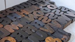 a close-up photo of wood blocks of the Round Gothic typeface