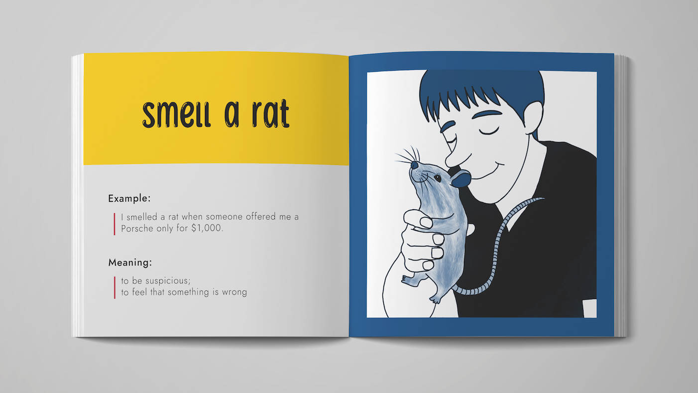 The image shows a mock-up of an opened picture book. An idiom 