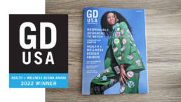 A cover of a Graphic Design USA magazine and a banner showing HEALTH + WELLNESS DESIGN AWARDS 2022 WINNER